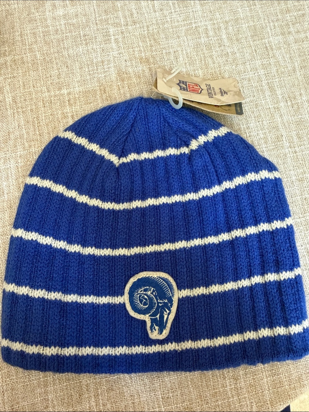 Blue and White Striped Knit Beanie with Rams Patch